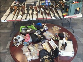Six people are facing nearly 100 charges after police seized loaded firearms, weapons, drugs and stolen property from a Lethbridge him in the 800 block of 6 Street South on May 26, 2016.