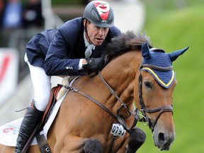 Ian Millar from Canada takes part in the Spectra Energy Cup on his horse Dixon at Spruce Meadows in SW Calgary, Alta. on Thursday June 5, 2014. Stuart Dryden/Calgary Sun/QMI Agency