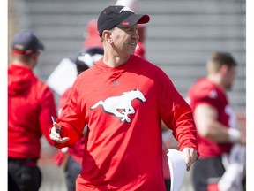 Head coach Dave Dickenson works during the Calgary Stampeders training camp at McMahon Stadium in Calgary, Alta., on Tuesday, May 31, 2016. The regular season begins on June 25, when the Stamps head to B.C.