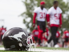 A helmet sits on the sidelines during the Calgary Stampeders training camp on June 2, 2016, at McMahon Stadium in Calgary.