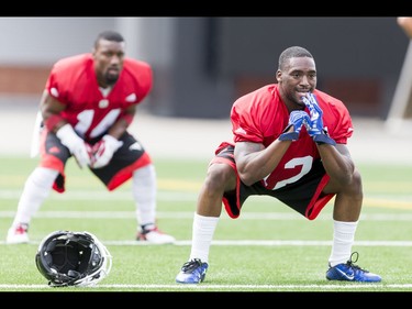 Roy Finch (R) and Reggie Whatley warm up on Day 1 of the Calgary Stampeders rookie camp at McMahon Stadium in Calgary, Alta., on Thursday, May 26, 2016. Regular training camp was set to begin on May 29.  Lyle Aspinall/Postmedia Network