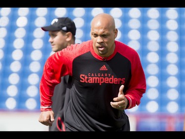 Guest coach and recently retired player Juwan Simpson watches the field on Day 1 of the Calgary Stampeders rookie camp at McMahon Stadium in Calgary, Alta., on Thursday, May 26, 2016. Regular training camp was set to begin on May 29.  Lyle Aspinall/Postmedia Network