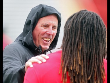 Calgary Stampeders GM John Hufnagel chats along the sidelines during the team's rookie camp Friday May 27, 2016. The main camp opens Sunday. (Ted Rhodes/Postmedia)