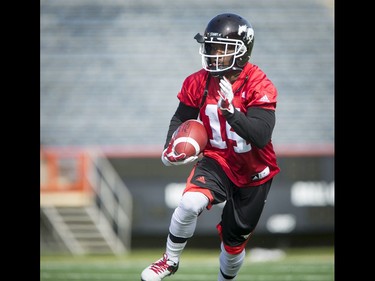 Roy Finch runs with the ball during the Calgary Stampeders training camp in Calgary, Alta., on Monday, May 30, 2016. The regular season begins on June 25, when the Stamps head to B.C. Lyle Aspinall/Postmedia Network