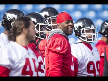 Jerome Messam has a laugh during the Calgary Stampeders training camp in Calgary, Alta., on Monday, May 30, 2016. The regular season begins on June 25, when the Stamps head to B.C. Lyle Aspinall/Postmedia Network