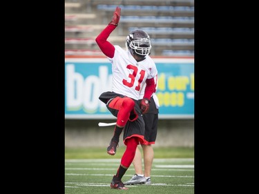 Brandon McDonald dances to country music during the Calgary Stampeders training camp at McMahon Stadium in Calgary, Alta., on Thursday, June 2, 2016. The regular season begins on June 25, when the Stamps head to B.C. Lyle Aspinall/Postmedia Network