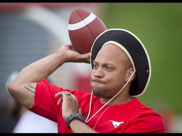 Guest coach Juwan Simpson throws a ball during the Calgary Stampeders training camp at McMahon Stadium in Calgary, Alta., on Thursday, June 2, 2016. The regular season begins on June 25, when the Stamps head to B.C. Lyle Aspinall/Postmedia Network