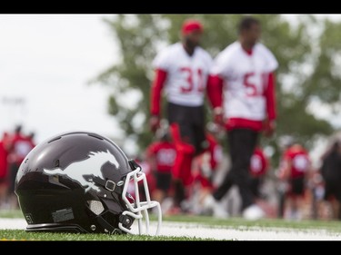 A helmet sits on the sidelines during the Calgary Stampeders training camp at McMahon Stadium in Calgary, Alta., on Thursday, June 2, 2016. The regular season begins on June 25, when the Stamps head to B.C. Lyle Aspinall/Postmedia Network