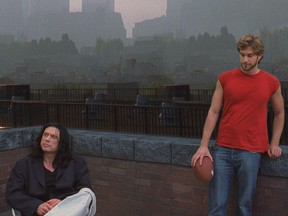 Johnny (Tommy Wiseau) and Mark (Greg Sestero) in a rooftop scene from The Room. Sestero, who wrote a book about the behind-the-scenes experience of filming the cult classic, comes to town for a screening with the Fifth Reel this weekend.