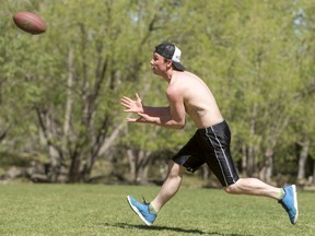 Dalton Burnett eyes a football while playing catch at Prince's Island Park in Calgary, Alta., on Tuesday, May 3, 2016. Temperatures were soaring in Calgary as a long stretch of hot days were making April weather consistently balmy.