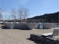 The concrete sculptures block the view of the Bow River from the benches at this Parkdale park at 34A Street N.W.