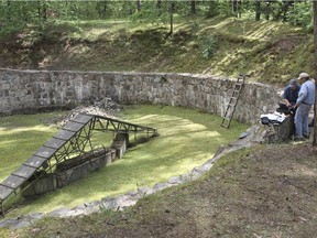 This photograph released by the Israel Antiquities Authority shows preparation for a scan of the pit used to hold the victims before their execution at Ponar massacre site near the town of Vilnius, Lithuania. Some 100,000 people, including 70,000 Jews, were killed and thrown into pits during the Nazi occupation. (Ezra Wolfinger/Israel Antiquities Authority via AP)