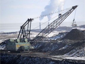 A giant drag line works in the Highvale Coal Mine to feed the nearby Sundance Power Plant near Wabamun on Friday, Mar. 21, 2014.