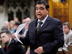 Conservative MP Deepak Obhrai stands in the House of Commons during question period in Ottawa, Friday, May 30, 2014. THE CANADIAN PRESS/Fred Chartrand