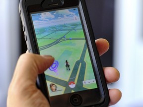 Pokemon Go is displayed on a cell phone in Los Angeles on Friday, July 8, 2016. Just days after being made available in the U.S., the mobile game Pokemon Go has jumped to become the top-grossing app in the App Store. And players have reported wiping out in a variety of ways as they wander the real world, eyes glued to their smartphone screens, in search of digital monsters.