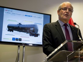 Federal Transport Minister Marc Garneau makes an announcement in Montreal on Monday, July 25, 2016. Garneau confirmed older DOT-111 rail tanker cars will not be able to transport crude oil or other dangerous goods as of Nov. 1. The cars are the same model that was involved in the deadly Lac-Megantic tragedy in which 47 people died three years ago. The ban kicks in on Nov. 1, six months earlier than planned for "non-jacketed" cars - those without a layer of thermal protection - and 16 months earlier than cars with jackets. THE CANADIAN PRESS/Peter McCabe