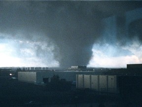 A massive tornado passes from south to north near 34th Street and 94th Avenue in Edmonton on Friday July 31, 1987. The tornado killed 27 people and injured hundreds, it also caused over $330 million in property damage.