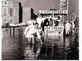 A sudden rainstorm led to flooding in the midway in the 1960s, as seen in this photo of a Fiddlesticks booth.