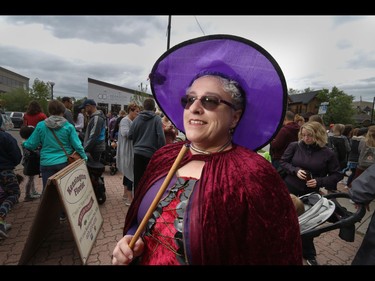 Irene St. John dressed up to do a little wizard-like shopping in Calgary, Ab., on Sunday July 31, 2016. Hundreds of Potter fans thronged Kensington which was reimagined as Diagon Alley to celebrate the release of Harry Potter And The Cursed Child.  Mike Drew/Postmedia