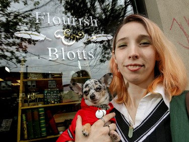 Sylvia Rothwell and her familiar, Rey, in front of Flourish and Blotts in Calgary, Ab., on Sunday July 31, 2016. Hundreds of Potter fans thronged Kensington which was reimagined as Diagon Alley to celebrate the release of Harry Potter And The Cursed Child.  Mike Drew/Postmedia