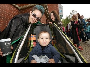 Little Harry look-alike Keegan White with Jocelyn Barron and Brooklyn Campeau in Calgary, Ab., on Sunday July 31, 2016. Hundreds of Potter fans thronged Kensington which was reimagined as Diagon Alley to celebrate the release of Harry Potter And The Cursed Child.  Mike Drew/Postmedia