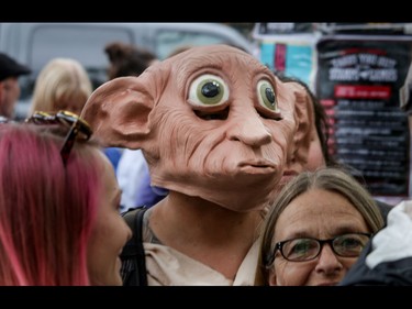 Even house elf Dobbie had to wait in line for the new Harry Potter Book in Calgary, Ab., on Sunday July 31, 2016. Hundreds of Potter fans thronged Kensington which was reimagined as Diagon Alley to celebrate the release of Harry Potter And The Cursed Child.  Mike Drew/Postmedia