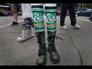 Some people wear their house allegiance on the sleeve, others on their shins as they wait in line for the new Harry Potter Book in Calgary, Ab., on Sunday July 31, 2016. Hundreds of Potter fans thronged Kensington which was reimagined as Diagon Alley to celebrate the release of Harry Potter And The Cursed Child.  Mike Drew/Postmedia