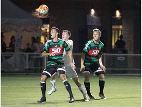 A pair of Foothills FC players challenge an FC Tucson player for the ball during Saturday's 2-1 win over the host team in Tucson, Ariz. Foothills next plays the Ocean City Nor'easters in a semifinal next weekend. (Michael Benson)