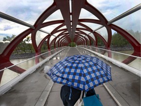 A pedestrian walks on the Peace Bridge. The city is adding another crosswalk in hopes of preventing jaywalking.