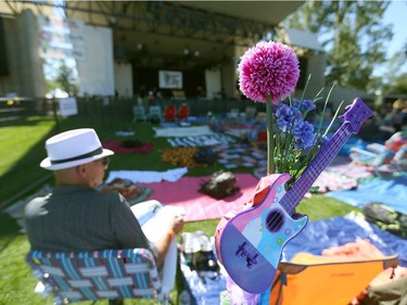 A small colored guitar marks a blanket position during opening night at Calgary Folk Festival 2016 on Prince's Island in Calgary, Alta. on Thursday, July 21, 2016. Jim Wells/Postmedia