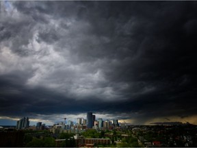 Commuters might want to watch out for fog patches in the morning hours. Environment Canada says there will be a mix of sun and cloud on Thursday with a 30 per cent chance of showers and a possible thunderstorm this afternoon. A thunderstorm moves in over downtown Calgary on Saturday July 30, 2016.