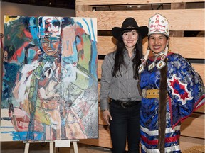Artist Amy Dryer with Calgary Stampede Indian Princess Vanessa Stiffarm, whose image she painted as part of the Stampede's 2016 Artist Ranch Project. Photo courtesy Calgary Stampede
