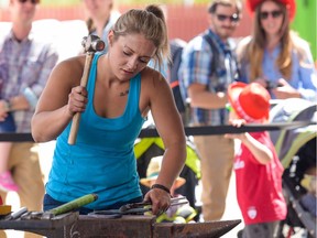 Crossfield-area blacksmith Riley Swanby crafts a horseshoe at the 2016 Calgary Stampede on July 8, 2016.