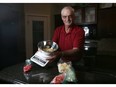 Blane Charles and the kitchen/scale bowl the city sent him so he could participate in a survey on food waste in Calgary, Alta., on Tuesday July 26, 2016. Leah Hennel/Postmedia