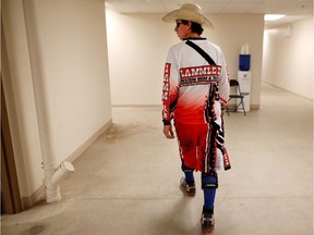 Bullfighter Monty Phillips takes the short walk to the arena at the Calgary Stampede  in Calgary, Alta., on Tuesday July 12, 2016. Leah Hennel/Postmedia