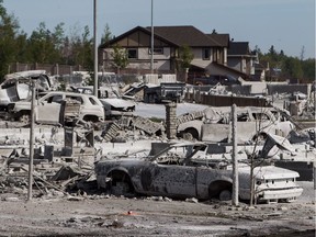 Burned-out homes and vehicles were a grim reminder of the fire when Fort McMurray residents returned to the city in early June.