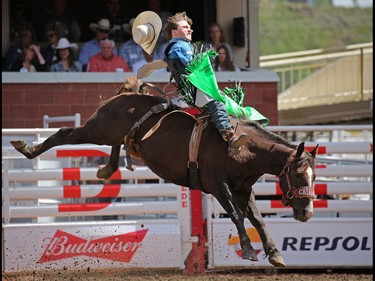 Connor Hamilton from Calgary competes in the Novice Saddle Bronc event on Day 3 of the Calgary Stampede Rodeo, Sunday July 10, 2016.