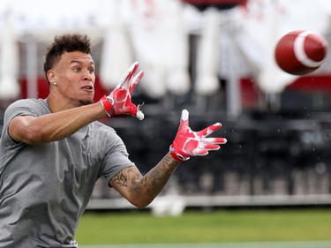 University of Calgary Dinos wide receiver Rashaun Simonise catches passes while being watched by six NFL scouts at McMahon Stadium in Calgary on Monday July 11, 2016. Simonise has been declared eligible for the NFL supplementary draft.