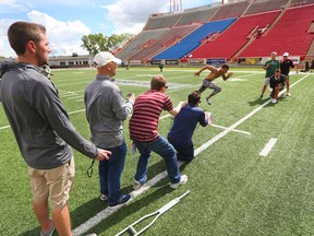 University of Calgary Dinos wide receiver Rashaun Simonise runs a 40 yard sprint for six NFL scouts at McMahon Stadium in Calgary on Monday July 11, 2016. Simonise has been declared eligible for the NFL supplementary draft.