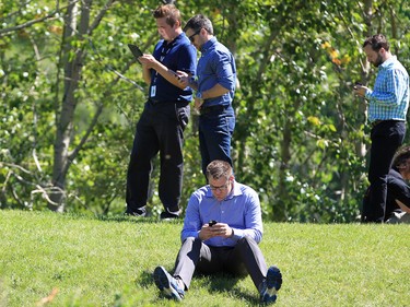 Dozens of Pokemon Go players play on Prince's Island in Calgary over the lunch hour on Tuesday July 19, 2016.