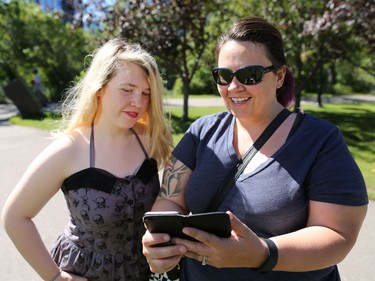 Karra Donnelly and her daughter Ava play Pokemon Go on Prince's Island in Calgary over the lunch hour on Tuesday, July 19, 2016.