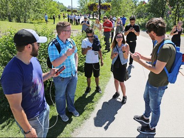 Dozens of Pokemon Go players play on Prince's Island in Calgary over the lunch hour on Tuesday, July 19, 2016.