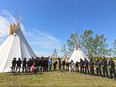 Police officers, firefighters and dignitaries gather for the sod turning for the new Tsuu T'ina police station on the reserve next to Calgary on July 26, 2016.