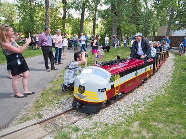 Calgary Mayor Naheed Nenshi drives the newly restored Bowness Park miniature train on the first official run on Thursday July 28, 2016. The train was destroyed in the 2013 floods and had to be completely restored by a team