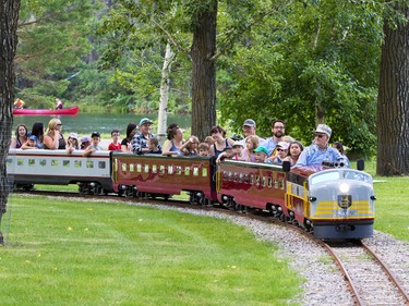 Allan Millard drives the newly restored Bowness Park miniature train on the first official run in Calgary on Thursday July 28, 2016. The train was destroyed in the 2013 floods and had to be completely restored by a team from the Call of the West Museum in High River led by Millard.
Gavin Young/Postmedia