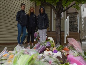 Calgarians gathered outside the home of Sara Baillie and her daughter Taliyah Leigh Marsman to show support and express their grief in Calgary, Alta., on Friday, July 15, 2016.  Elizabeth Cameron/Postmedia