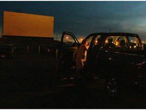 Calgary-08/15/04-Movie goers await the start of a Friday night triple feature at the Gemini Drive-In in Redcliff, the last drive-in theatre in the province. Photo by Ted Rhodes/Calgary Herald (For Observer story by Maria Canton) * DATE PUBLISHED AUGUST 22, 2004 PAGE B3  * Calgary Herald Merlin Archive *