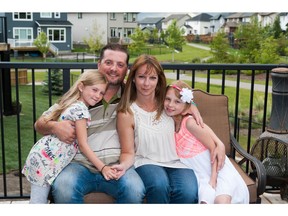 Marc and Allie Hollinger and their two children, Hannah (10) and Katie (7) in Drake Landing, Okotoks.