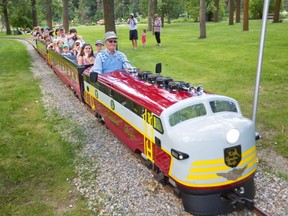 Allan Millard drives the newly restored Bowness Park miniature train on the first official run in Calgary on Thursday July 28, 2016