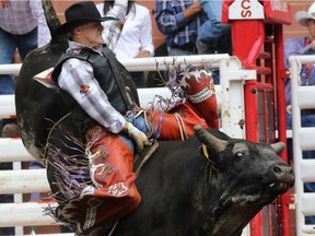 Devon Mezei rode 2 Dark 2 C to an 85 and top spot in the Bull Riding event on Day 2 of the Calgary Stampede Rodeo, Saturday July 9, 2016.